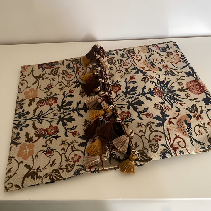 Vintage floral and bird jacquard table runner with tassels.