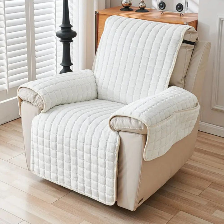 White quilted recliner chair cover with armrest protection and side pocket.