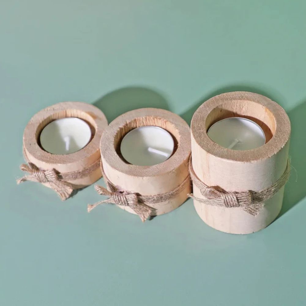 Set of 3 handcrafted bamboo candle holders with tea lights and jute twine accents.