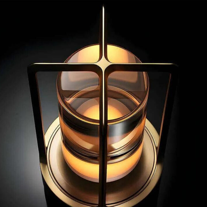 Crystal table lantern with a warm ambient glow and a metallic frame.