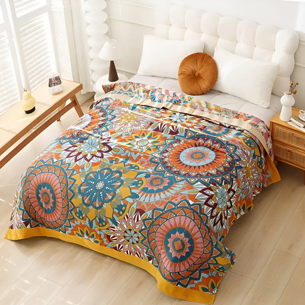 Moroccan floral jacquard cotton blanket in vibrant orange, blue, and pink mandala patterns.