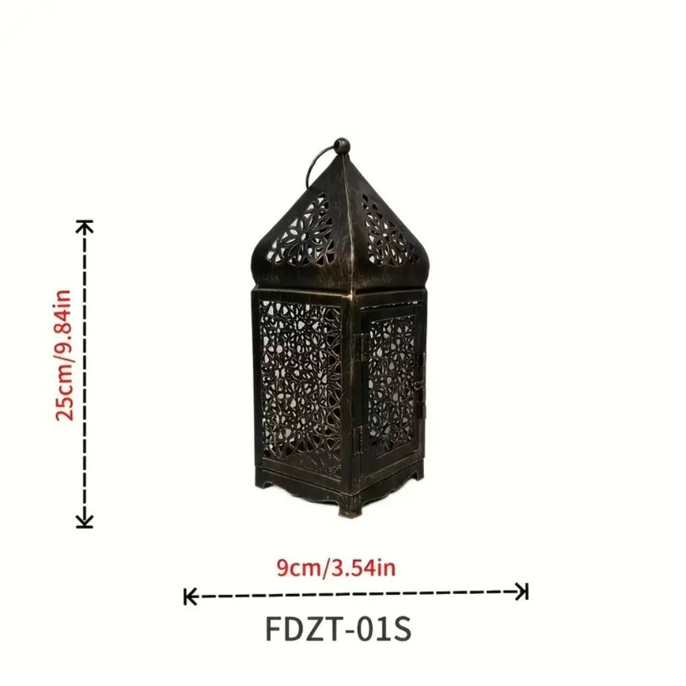 Ornate dark metal lantern with intricate cutouts, 25cm tall and 9cm wide.