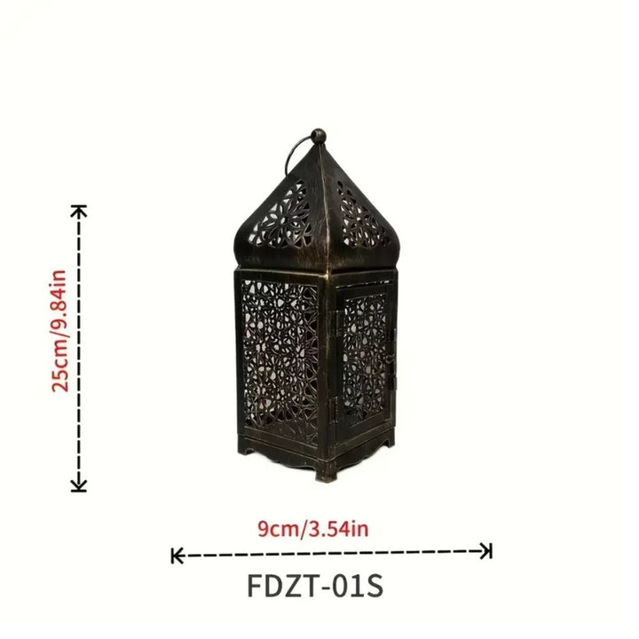 Ornate dark metal lantern with intricate cutouts, 25cm tall and 9cm wide.