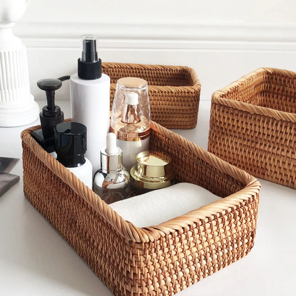 Artisan Rattan Storage Basket filled with skincare products on a white surface.