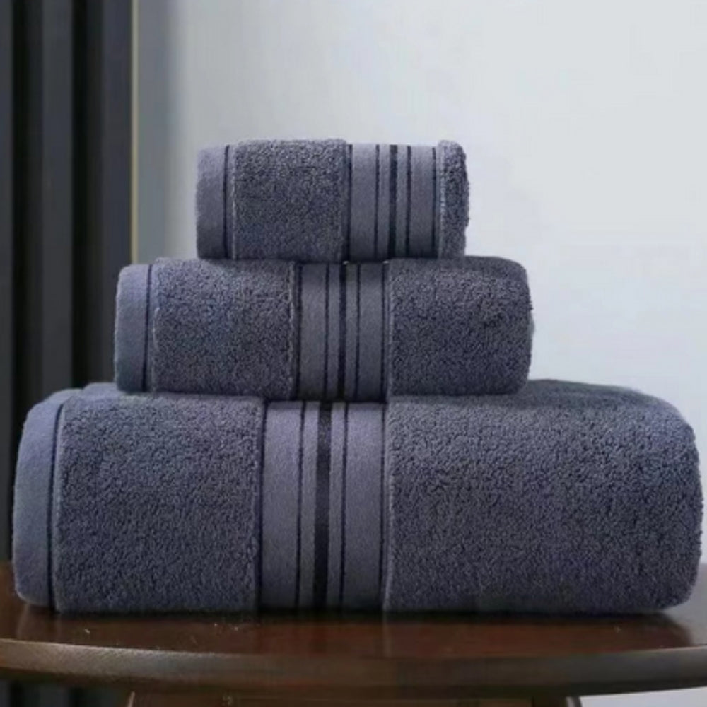 Three stacked dark gray Egyptian cotton towels with a striped band.