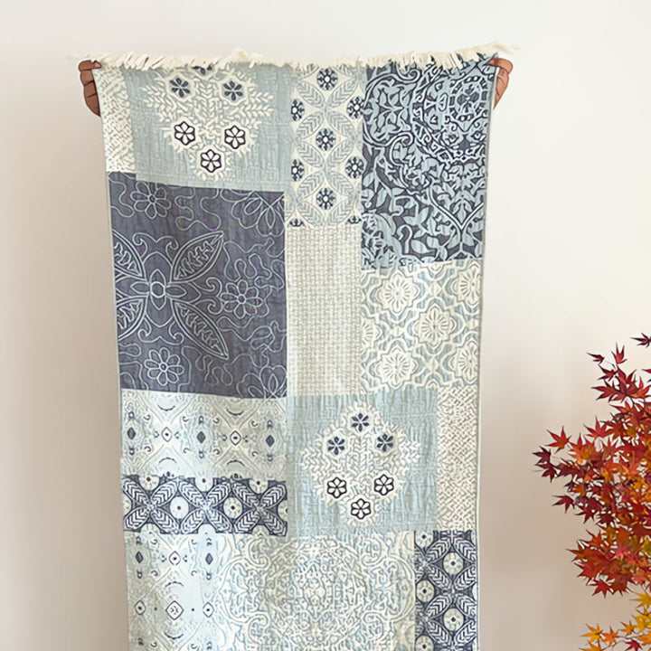 Patchwork pure cotton bath towel with blue and white floral and geometric patterns.
