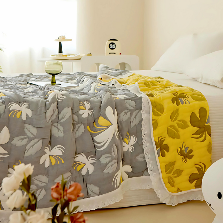 Elegant floral summer blanket with grey and yellow sides, featuring a white lace trim.