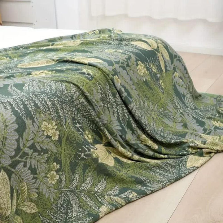 Green bamboo fiber cooling quilt with a botanical leaf and fern pattern.
