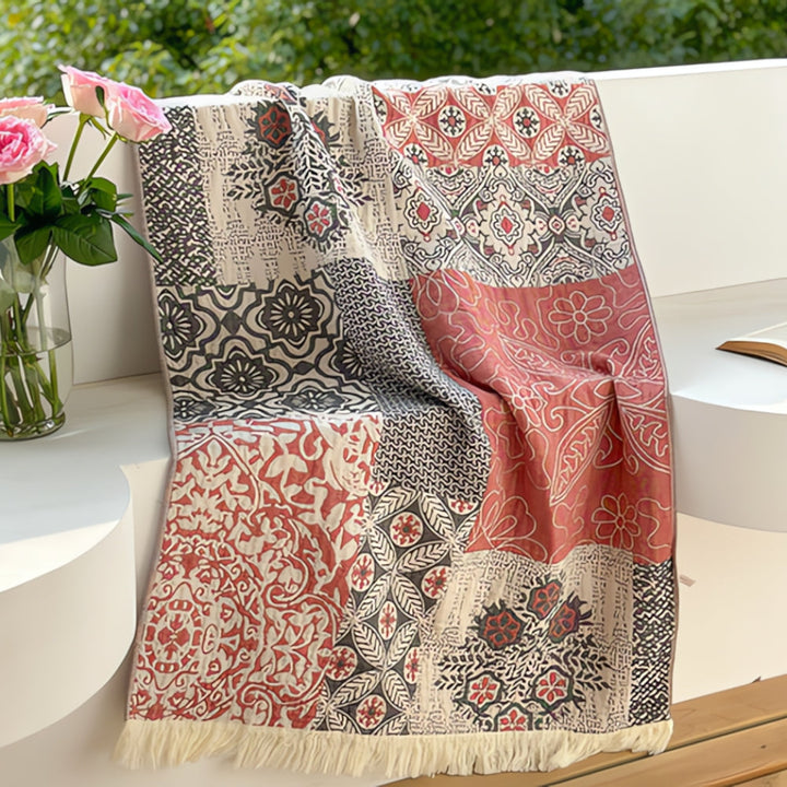 Patchwork pure cotton bath towel with red, black, and cream floral and geometric patterns.