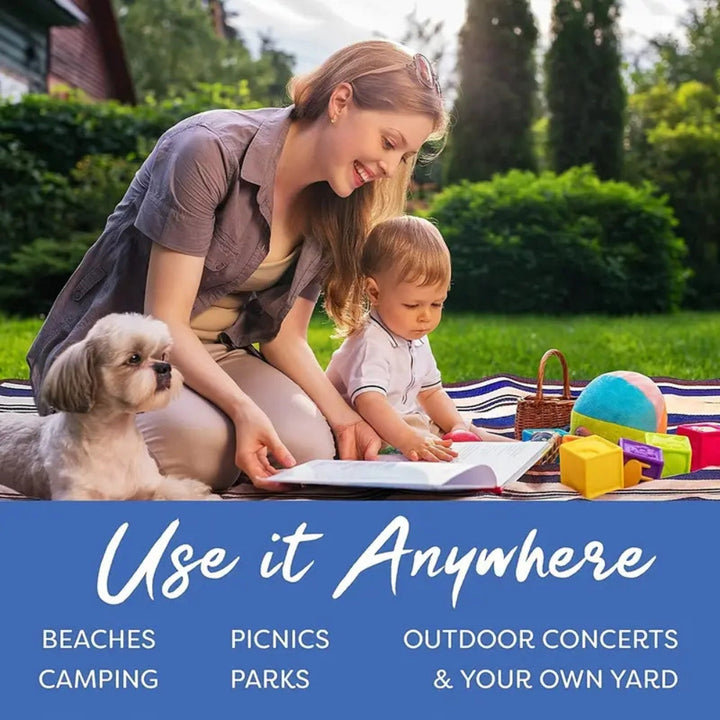 Woman and child with dog on a picnic mat, with text "Use it Anywhere: Beaches, Camping, Picnics, Parks, Outdoor Concerts &amp; Your Own Yard."