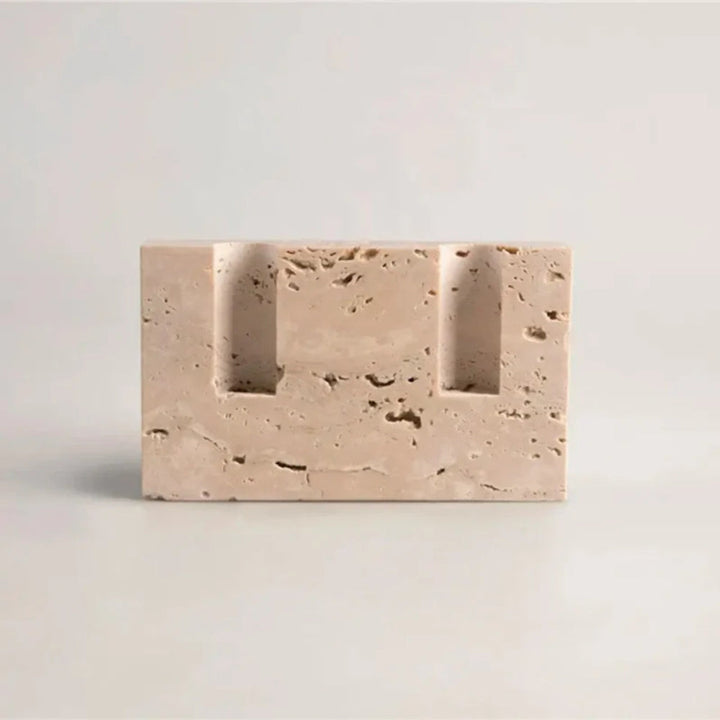 Beige travertine stone taper candle holder with two slots for candles.