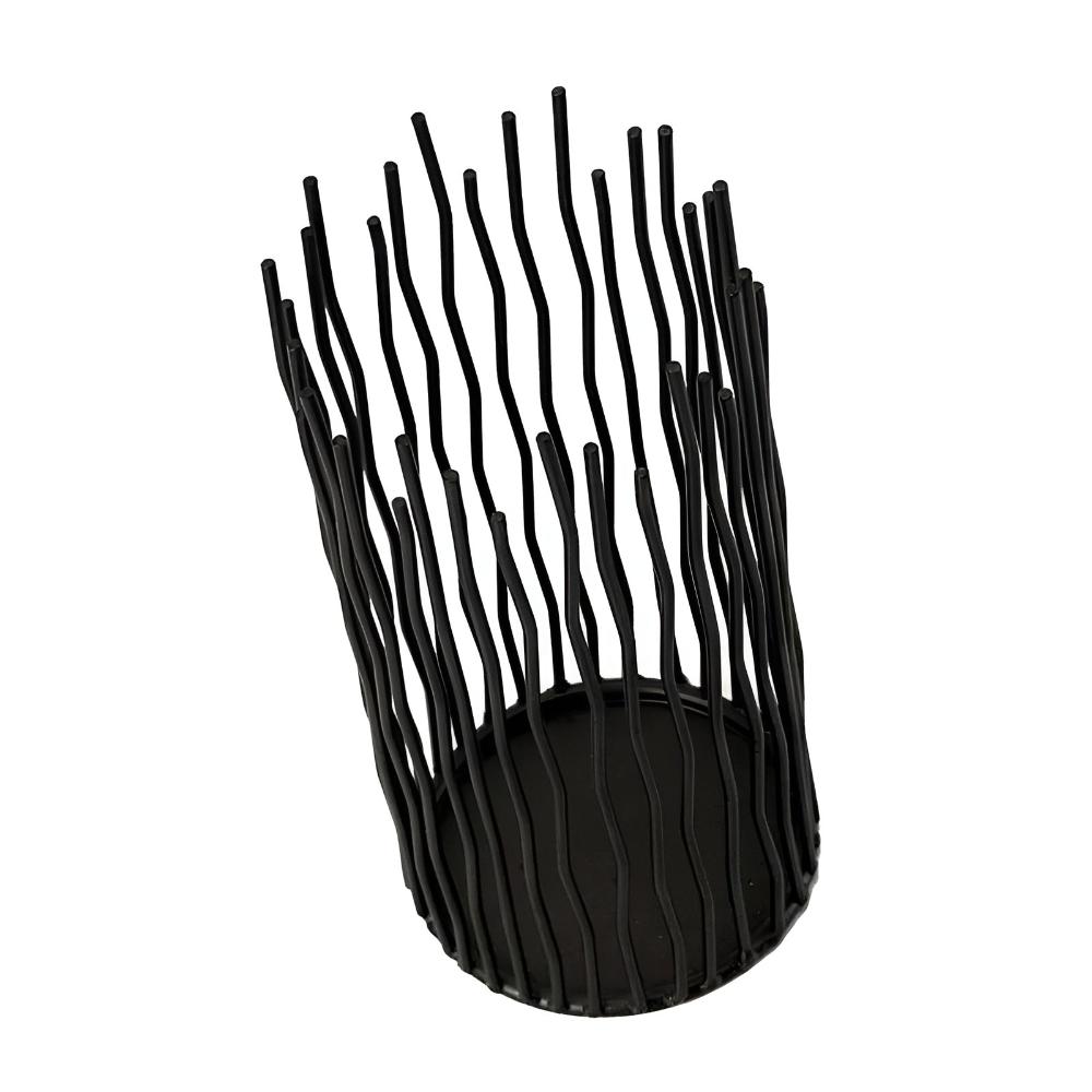Black iron desk candle holder with a geometric, modern design and wavy vertical bars.