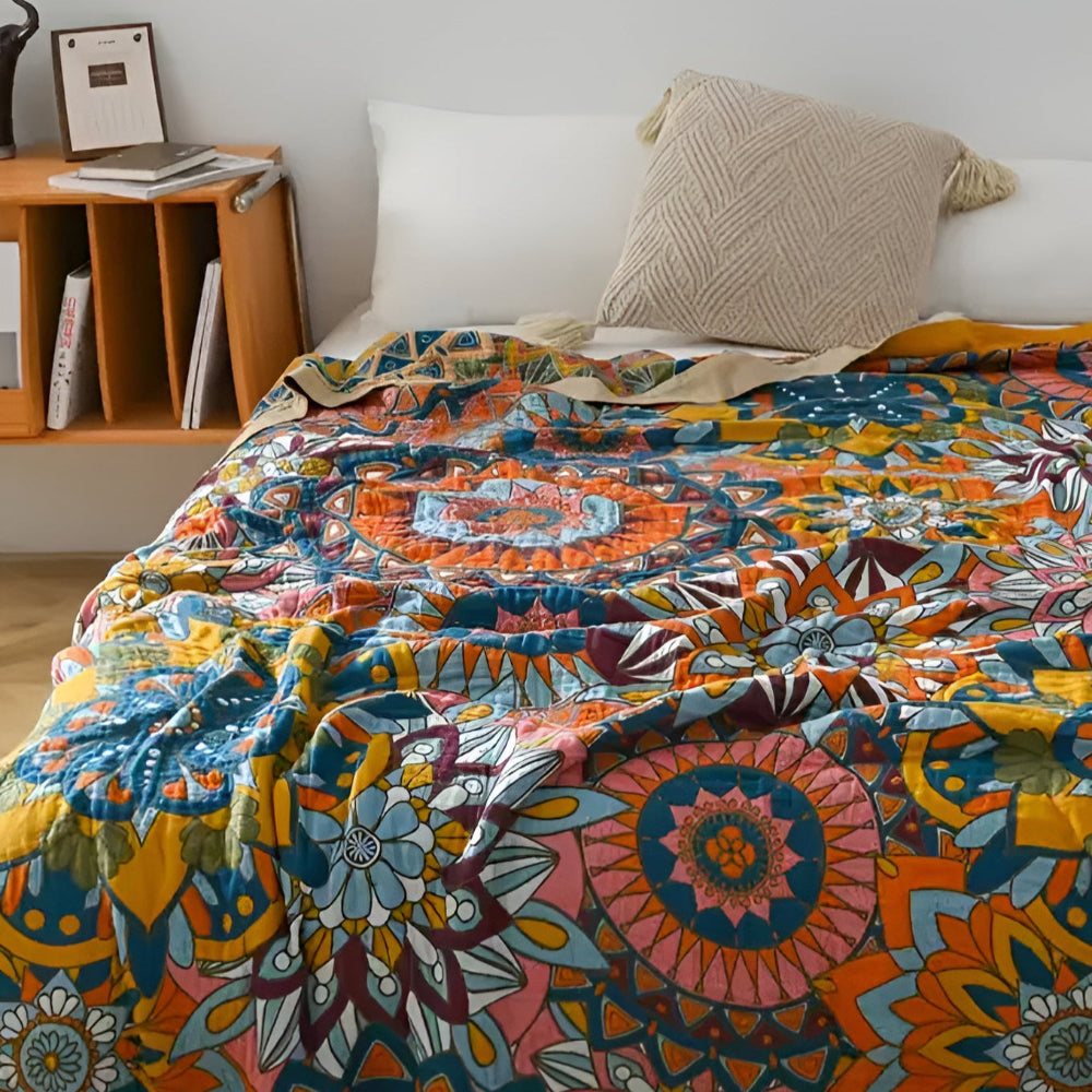 Moroccan floral jacquard cotton blanket with vibrant orange, blue, and yellow mandala patterns.