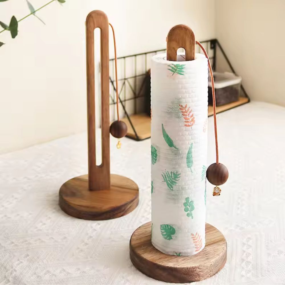 Acacia wood paper roll stand with a decorative wooden ball stopper.