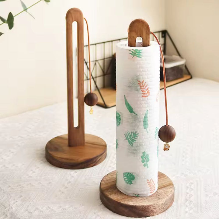Acacia wood paper roll stand with a decorative wooden ball stopper.