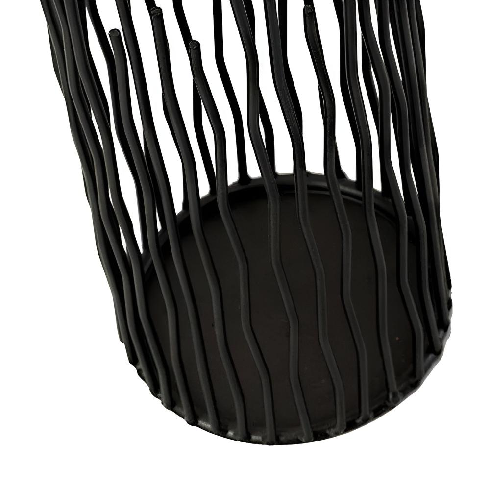 Black iron desk candle holder with a geometric, modern design and a sturdy base.