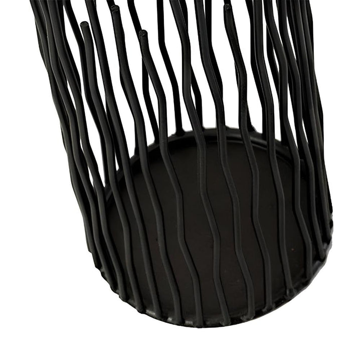 Black iron desk candle holder with a geometric, modern design and a sturdy base.