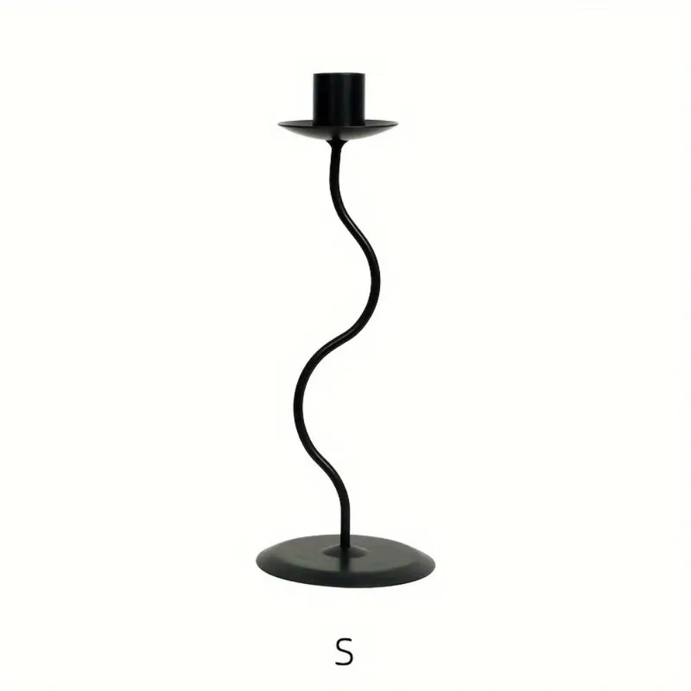 Black wavy iron candle holder with a round base and a top holder for a candle.