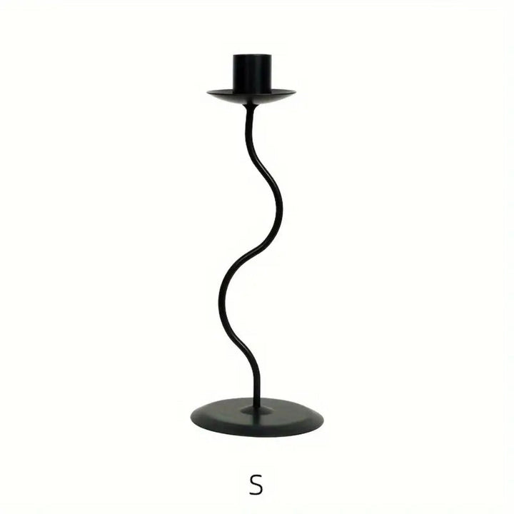 Black wavy iron candle holder with a round base and a top holder for a candle.