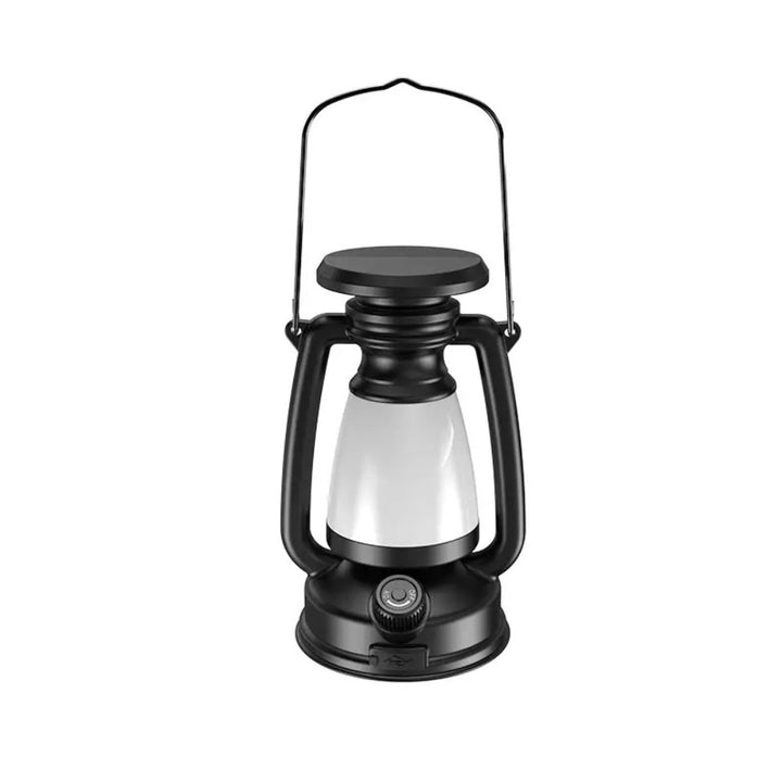Black solar camping lantern with a white frosted globe and a metal handle.