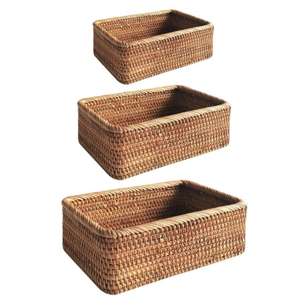 Three rectangular rattan storage baskets stacked vertically, hand-woven with a natural finish.