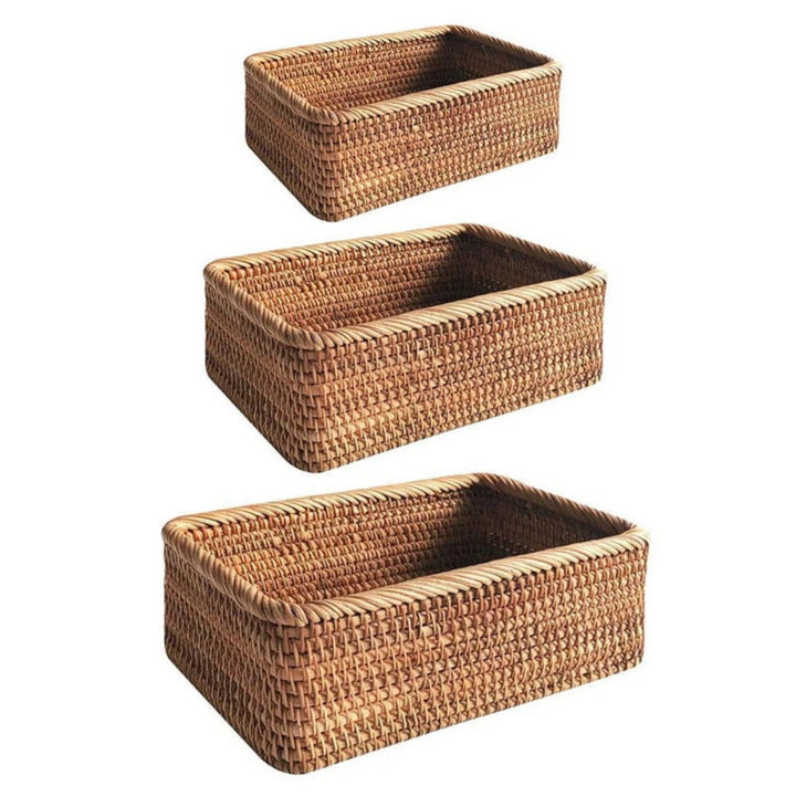 Three rectangular rattan storage baskets stacked vertically, hand-woven with a natural finish.