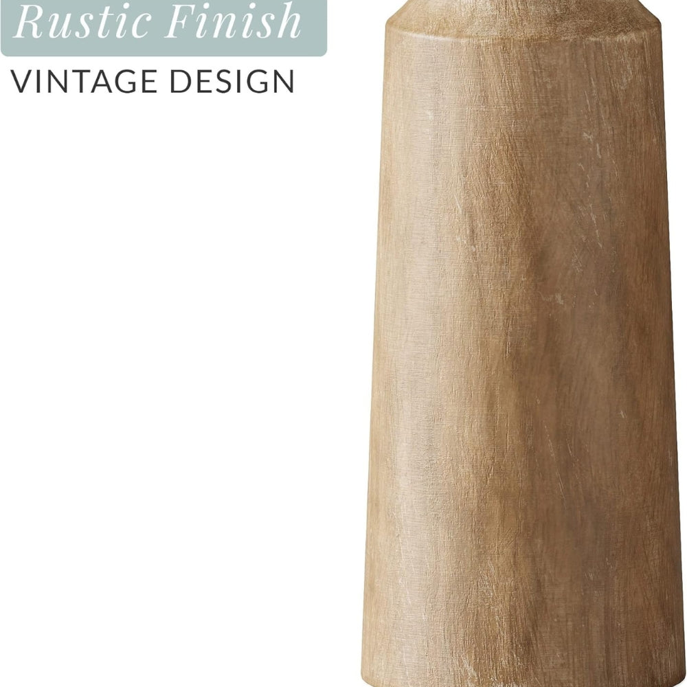 Carved pine candle holder with a rustic finish and vintage design.
