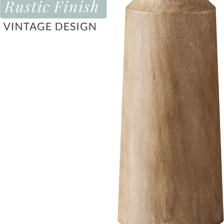 Carved pine candle holder with a rustic finish and vintage design.