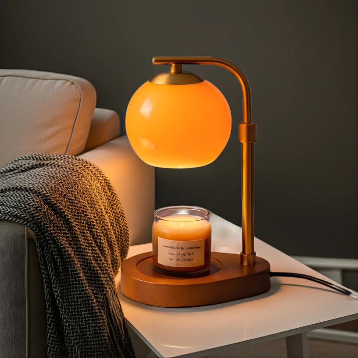 Sculpted Glass Candle Warmer Lamp with a retro amber globe and a lit candle on a wooden base.