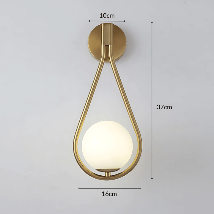 Brass teardrop wall sconce with a frosted glass globe, 37cm tall, 16cm wide.