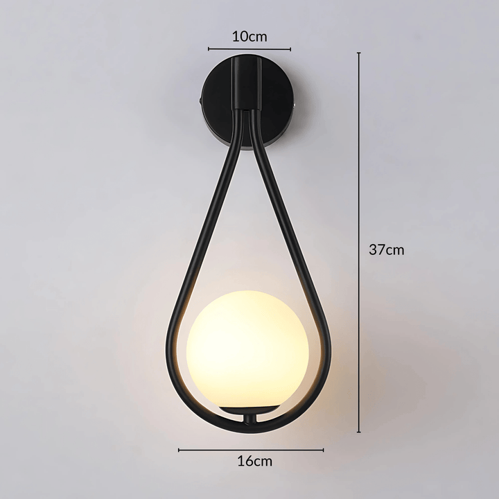 Black teardrop wall sconce with a frosted glass globe, 37cm tall, 16cm wide, and 10cm deep.