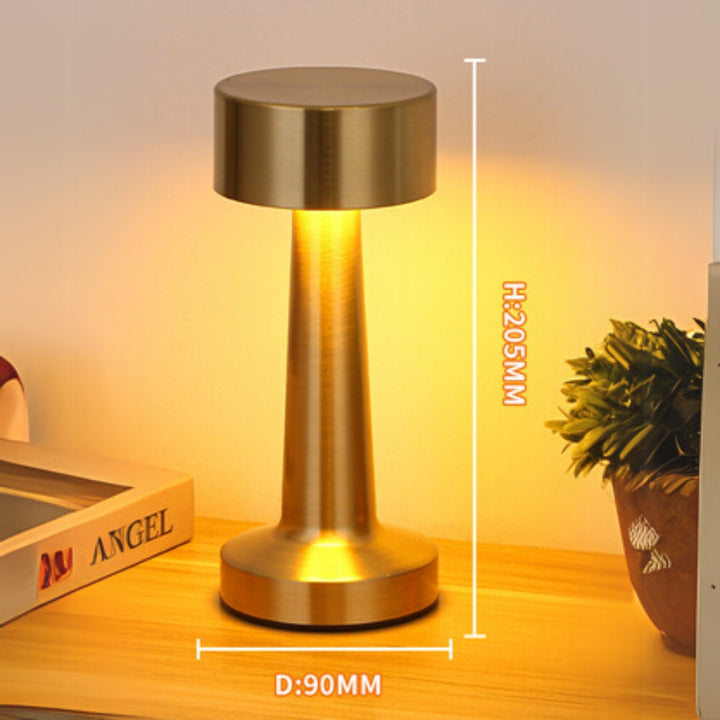 Portable LED desk lamp with a brushed brass finish, 205mm height and 90mm diameter.