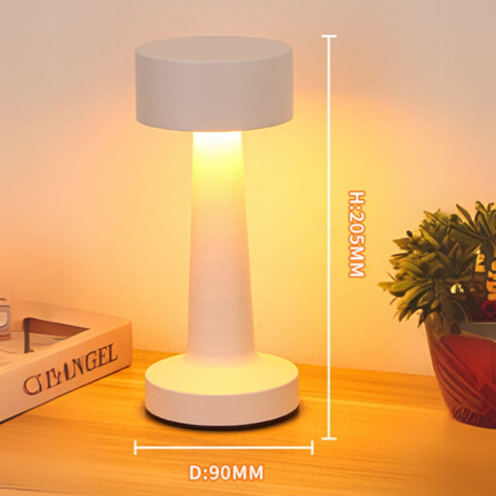 White portable LED desk lamp with dimensions H:205MM and D:90MM shown on a wooden surface.