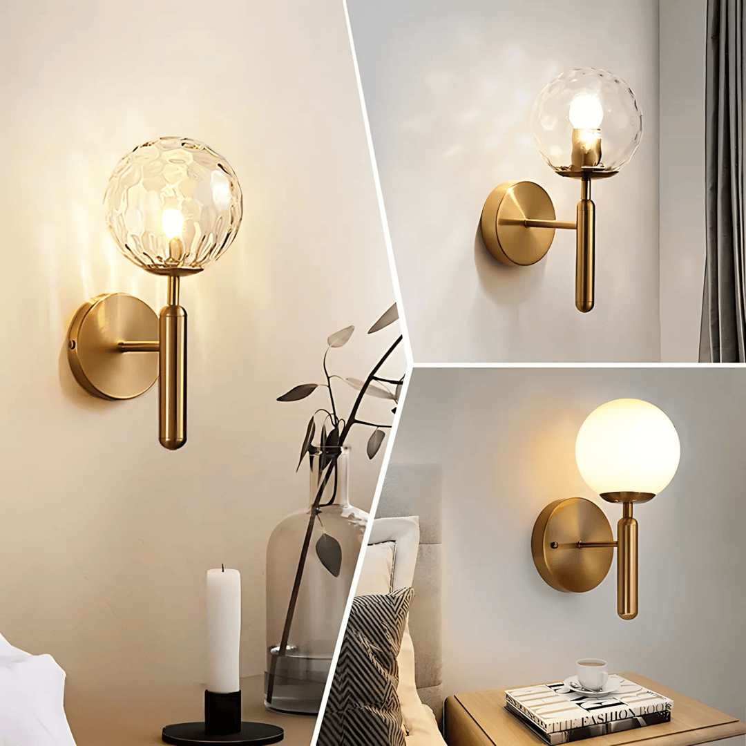 Brass metal wall sconce with a textured glass globe and a dimmable light.