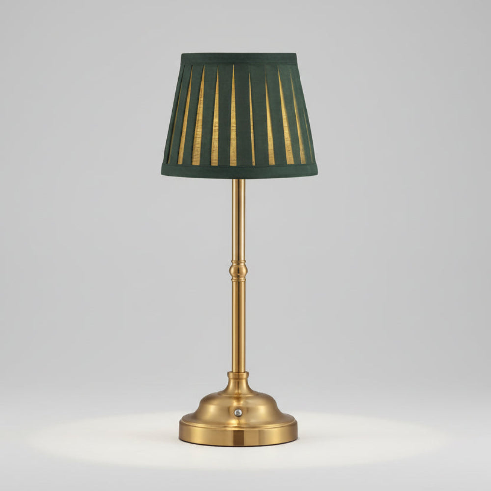 Brass cordless rechargeable table lamp with a dark green pleated shade and gold accents.