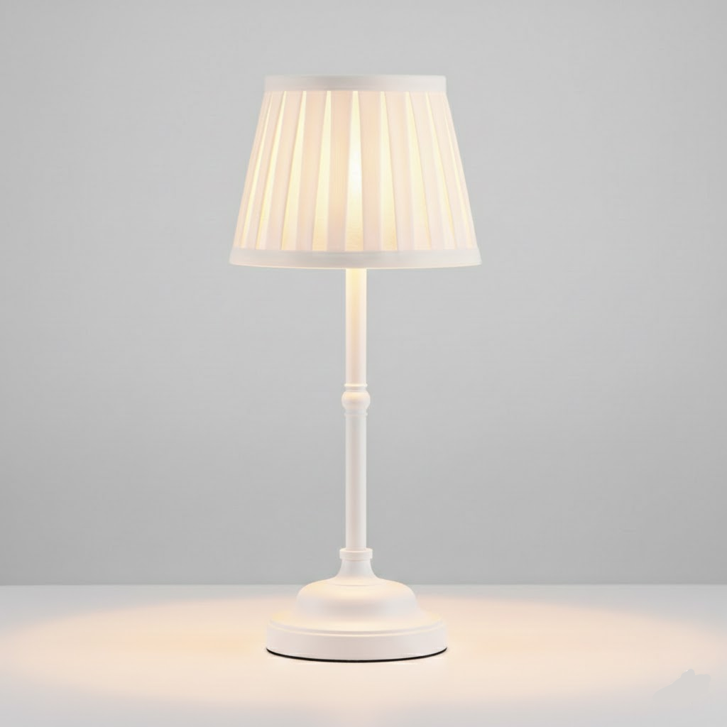 White cordless rechargeable table lamp with a pleated shade and a touch-sensitive base.