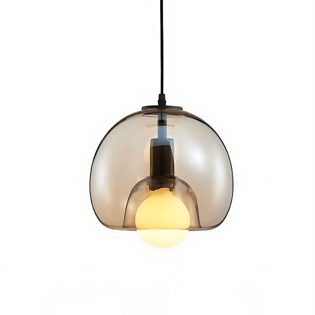 Handblown glass pendant light with a smoked grey finish and a warm white bulb.