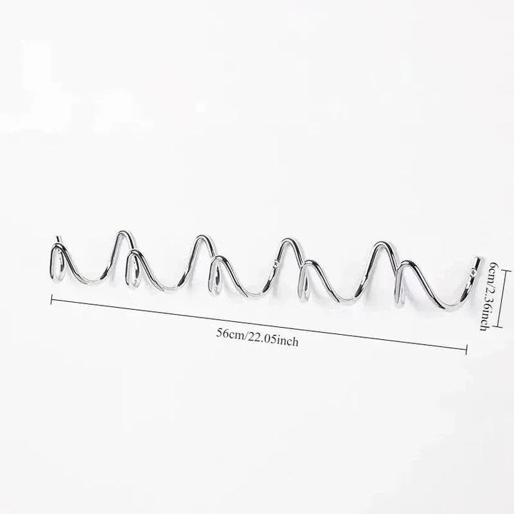 Wrought iron wall hook rack with an ocean wave design, 56cm long.