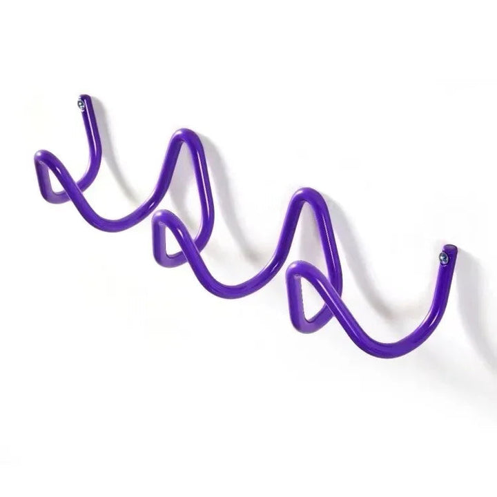 Purple wavy wrought iron wall hook rack with three curves for hanging items.