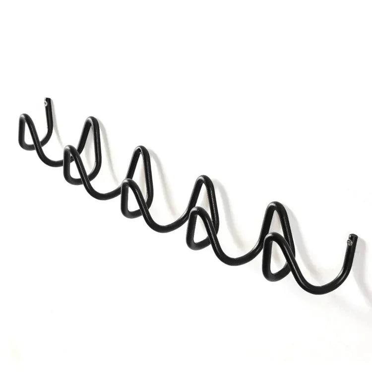 Black wrought iron wall hook rack with an ocean wave design, featuring multiple hooks.