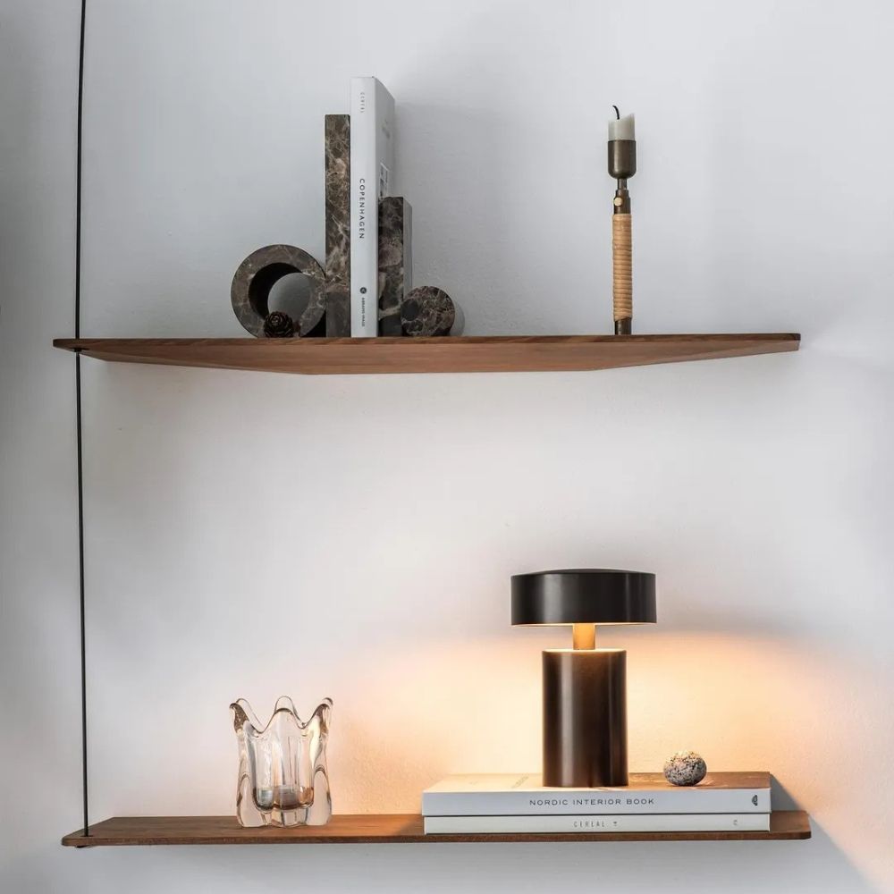 Column LED Table Lamp with a dark bronze finish on a wooden shelf.