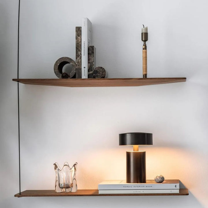 Column LED Table Lamp with a dark bronze finish on a wooden shelf.