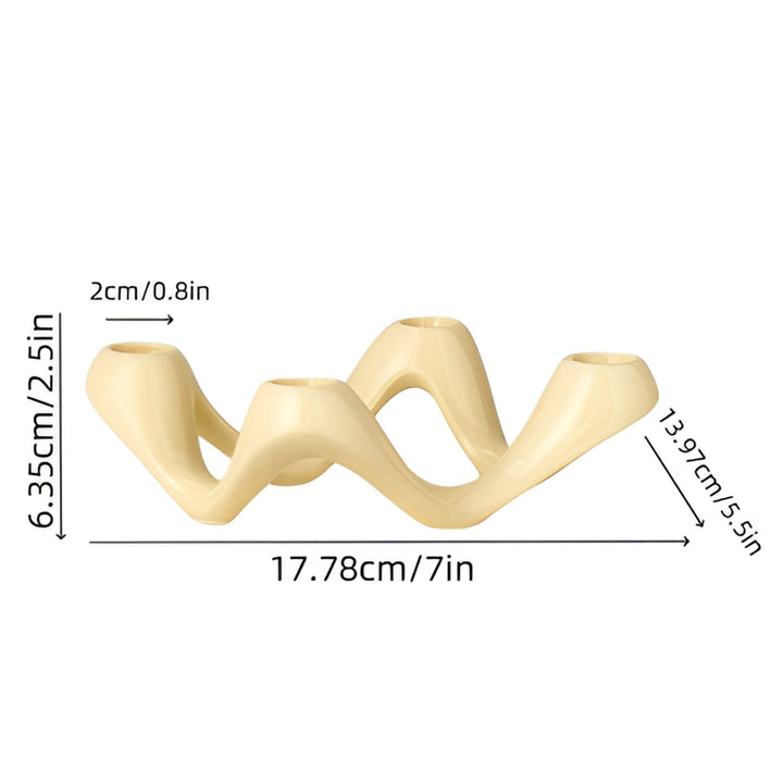 Cream ceramic candle holder with a flowing, wavy design, measuring 17.78cm/7in long.