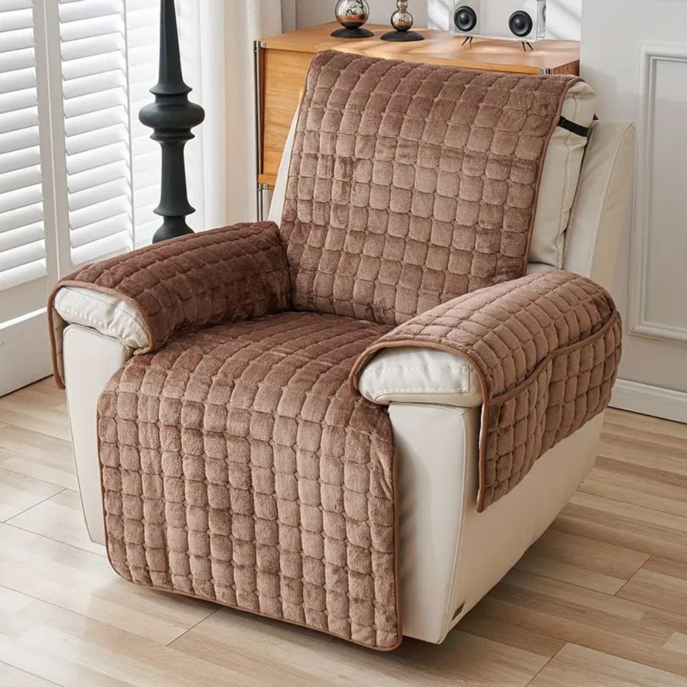 Brown quilted recliner chair cover with armrest covers on a white recliner.