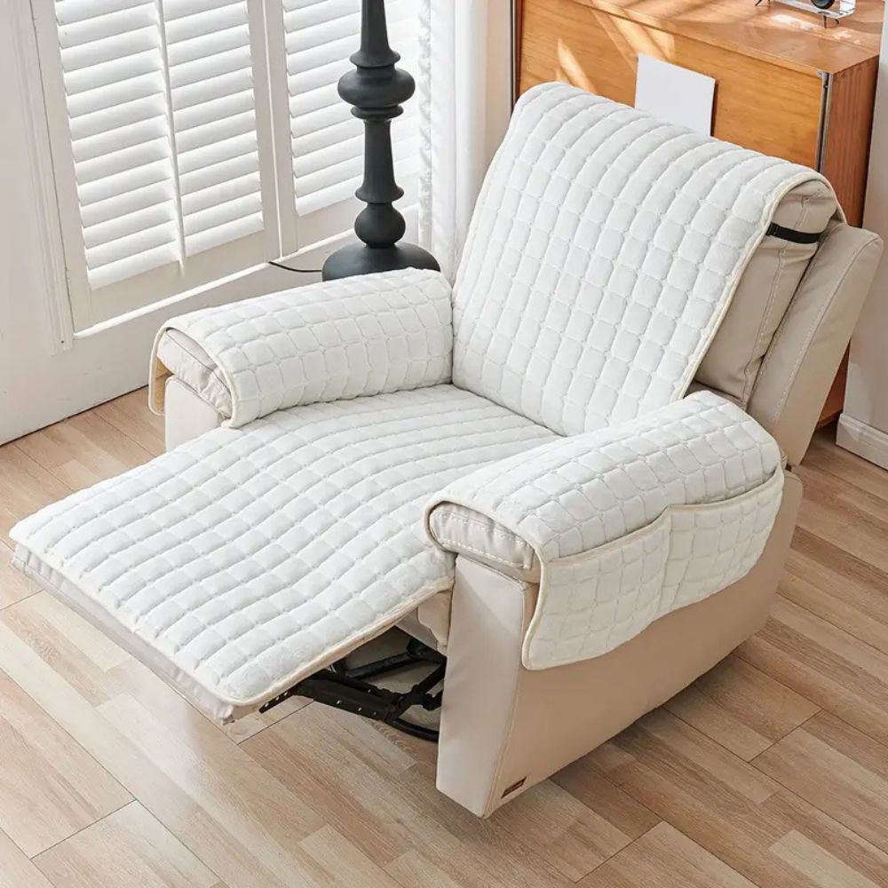 White quilted recliner chair cover with armrest pockets and extended footrest.