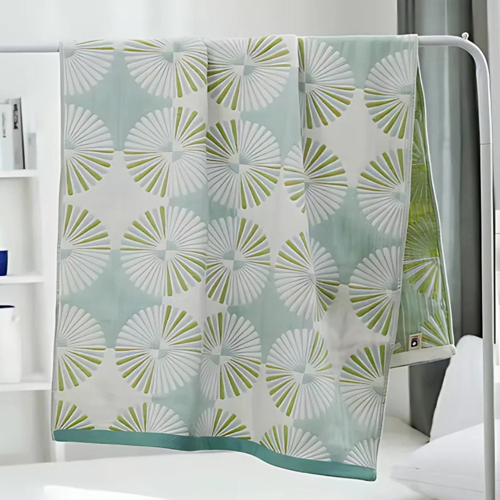 Dahlia Blossom Cotton Bath Towel with a light blue and white floral pattern.