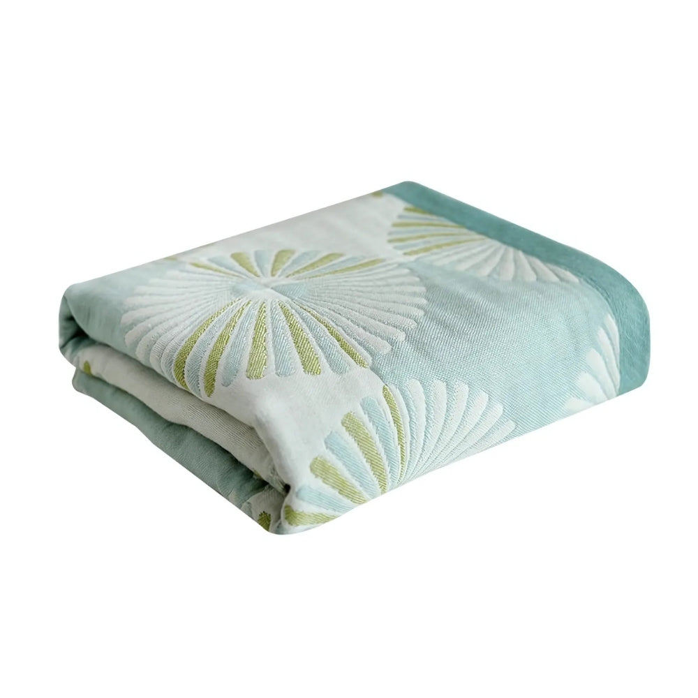 Blue cotton bath towel with a woven dahlia jacquard floral pattern.