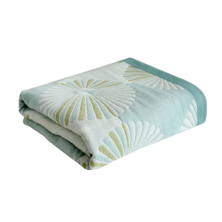 Light blue cotton bath towel with a repeating pattern of white and green dahlia blossoms.
