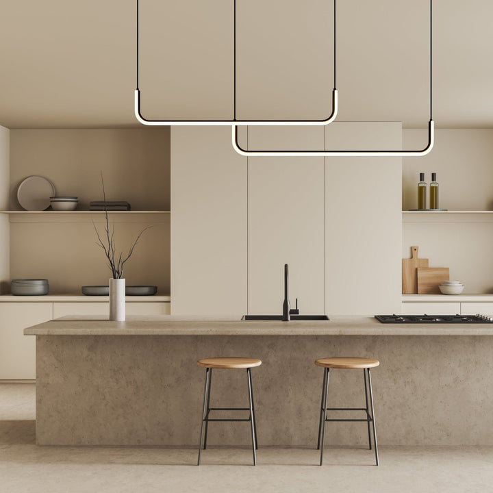 Modern adjustable pendant light with two rectangular frames hanging over a kitchen island.