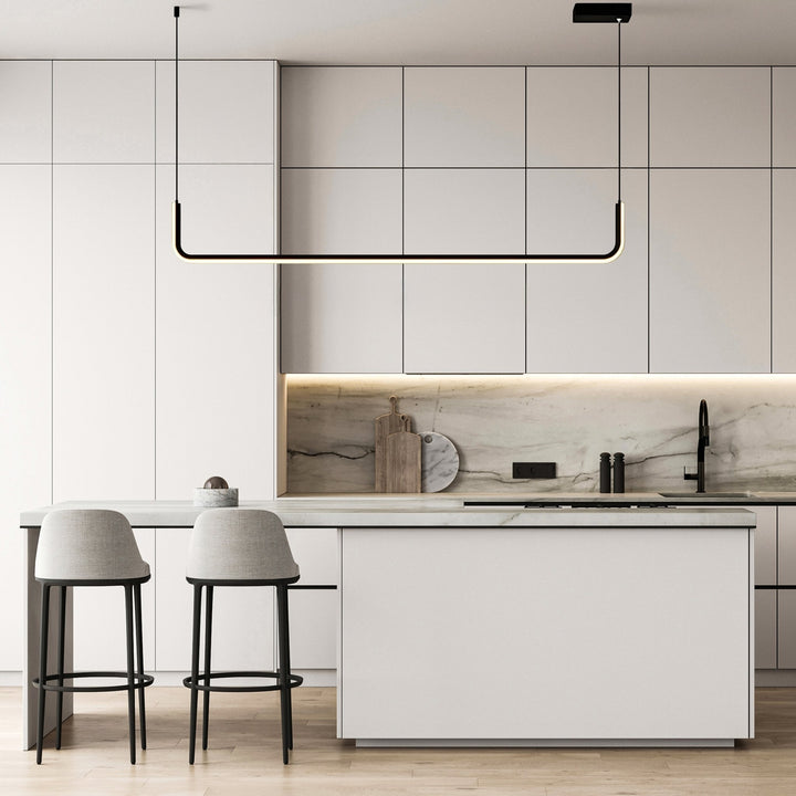 Modern adjustable pendant light with a black frame and integrated LED, suspended over a kitchen island.
